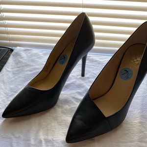 Black pointed toe pumps